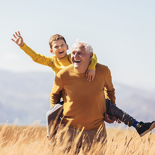 Happy old man with a young boy